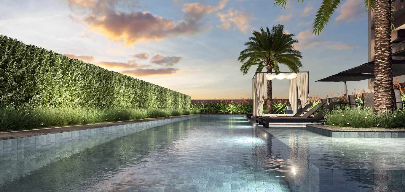 Uma área de piscina externa luxuosa em um complexo residencial moderno, com uma piscina azul clara, áreas de descanso confortáveis com almofadas, cercada por palmeiras e plantas bem cuidadas sob o céu brilhante.